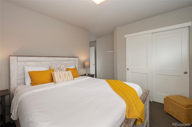 bedroom with carpet floors and a closet