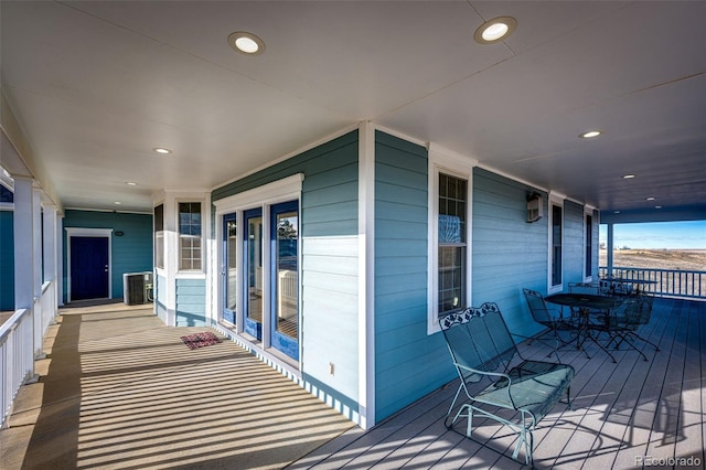 deck featuring a porch and central air condition unit