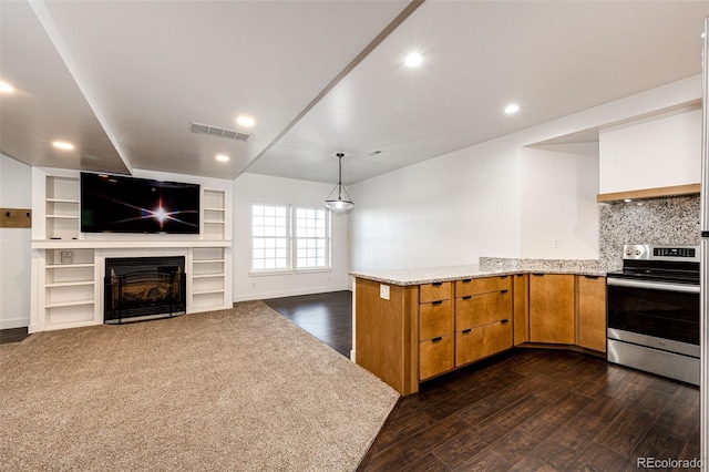 kitchen with light stone counters, dark wood finished floors, visible vents, electric range, and a glass covered fireplace