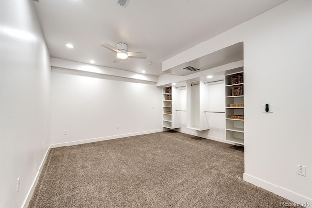 interior space with baseboards, visible vents, a ceiling fan, dark colored carpet, and recessed lighting