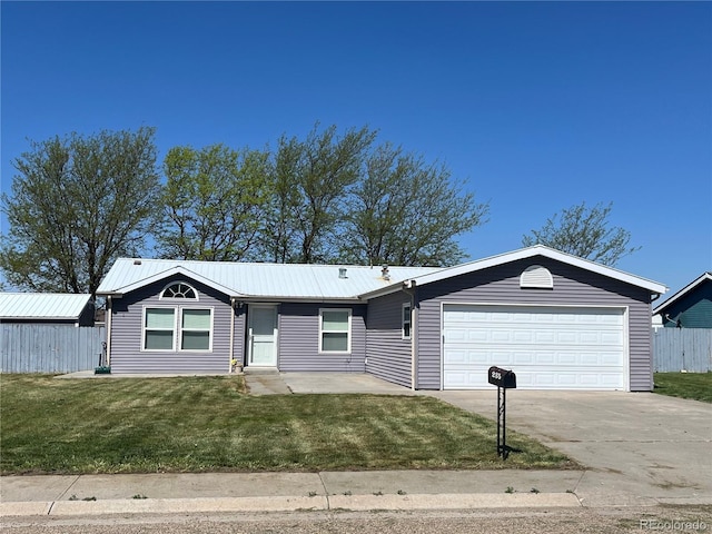 235 Marion St, Burlington, CO 80807 - ranch-style home with an attached garage, driveway, and metal roof