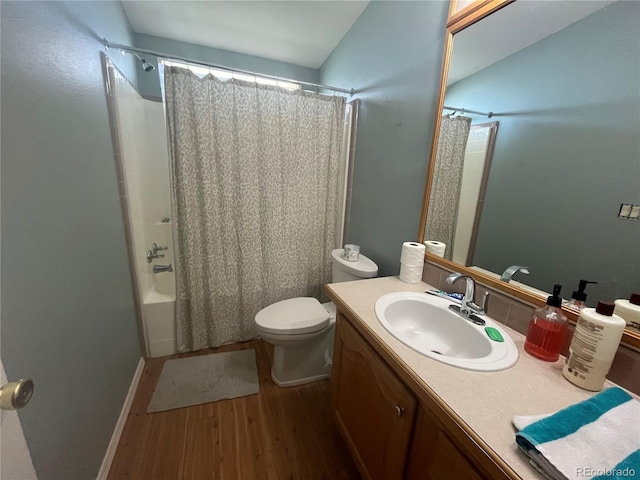 235 Marion St, Burlington, CO 80807 - bathroom featuring wood finished floors, vanity, toilet, shower / tub combo, and baseboards