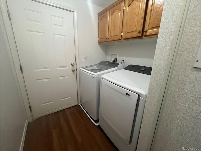 235 Marion St, Burlington, CO 80807 - laundry room with dark wood-type flooring, washer and clothes dryer, and cabinet space