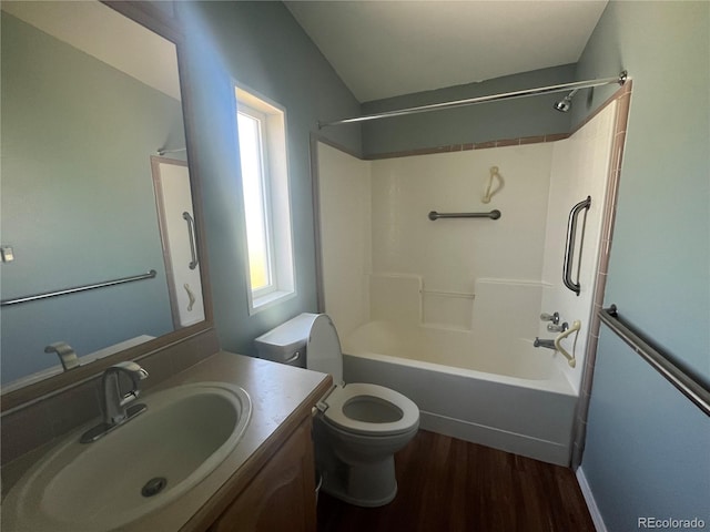 235 Marion St, Burlington, CO 80807 - full bath featuring wood finished floors, toilet, vanity, and  shower combination