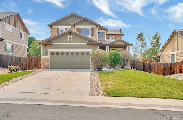 craftsman house featuring a garage and a front yard