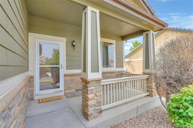 property entrance with covered porch