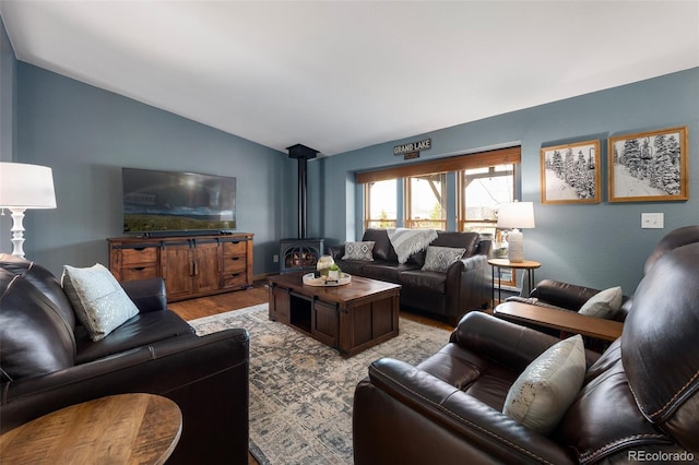 110 County Road 652, Grand Lake, CO 80447 - living room with lofted ceiling, light wood-style flooring, and a wood stove