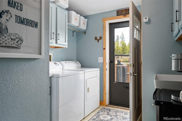 110 County Road 652, Grand Lake, CO 80447 - clothes washing area with cabinet space, independent washer and dryer, and a textured wall