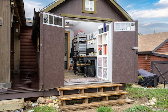110 County Road 652, Grand Lake, CO 80447 - back of house with stucco siding and entry steps