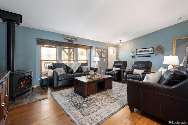 110 County Road 652, Grand Lake, CO 80447 - living area featuring a wood stove, lofted ceiling, and hardwood / wood-style floors