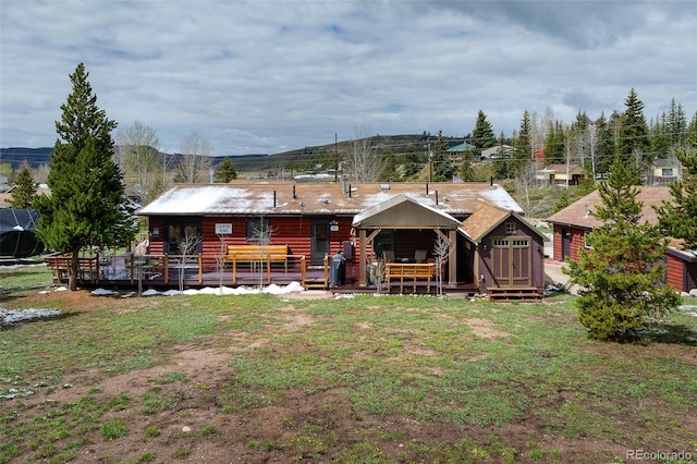 110 County Road 652, Grand Lake, CO 80447 - back of property featuring a wooden deck and a yard