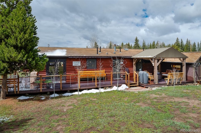 110 County Road 652, Grand Lake, CO 80447 - rear view of property featuring a wooden deck, a lawn, and faux log siding