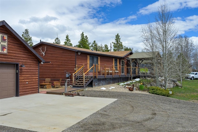 110 County Road 652, Grand Lake, CO 80447 - view of front of house featuring driveway, a garage, and a wooden deck