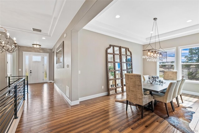 9563 Red Primrose St, Franktown, CO 80116 - dining space with a tray ceiling, a chandelier, wood finished floors, and recessed lighting