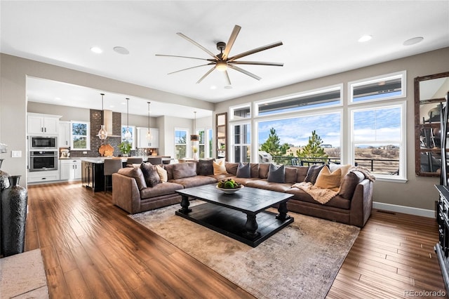 9563 Red Primrose St, Franktown, CO 80116 - living area featuring ceiling fan, hardwood / wood-style flooring, and recessed lighting