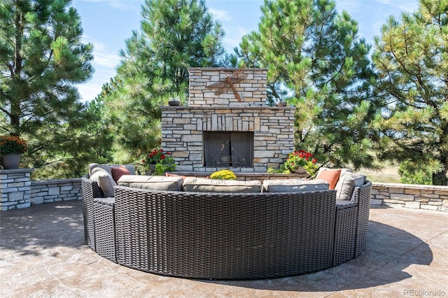 9563 Red Primrose St, Franktown, CO 80116 - view of patio with an outdoor stone fireplace