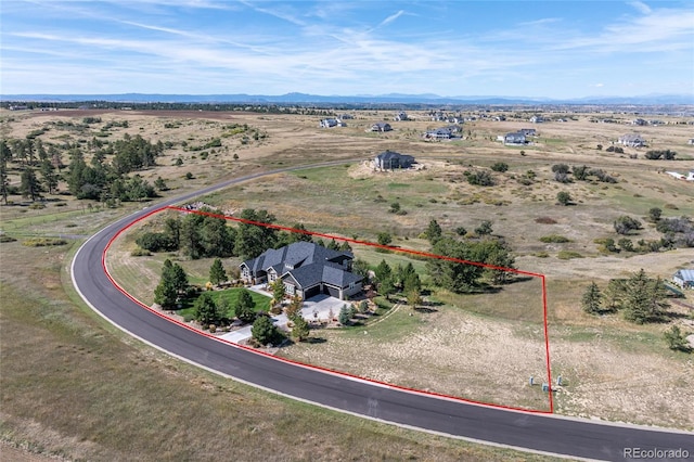 9563 Red Primrose St, Franktown, CO 80116 - overview of rural landscape with property parcel outlined and a mountain backdrop