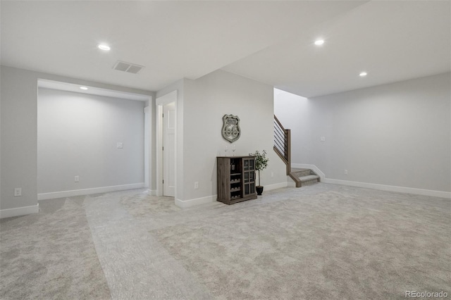 16510 Early Light Dr, Colorado Springs, CO 80908 - below grade area with carpet floors, recessed lighting, baseboards, visible vents, and stairway