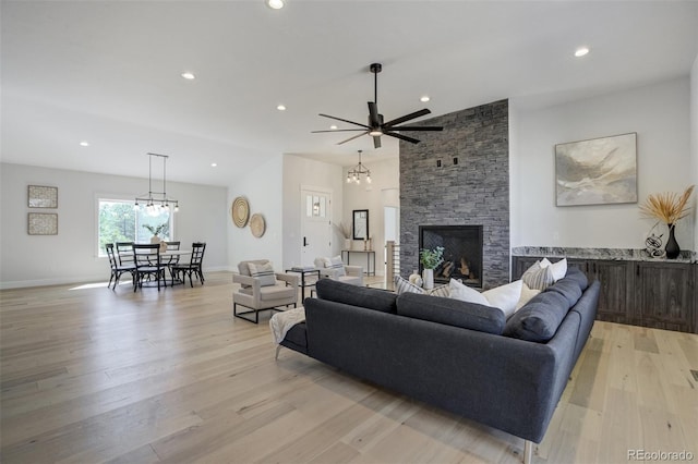16510 Early Light Dr, Colorado Springs, CO 80908 - living room with light wood-style floors, recessed lighting, and ceiling fan with notable chandelier