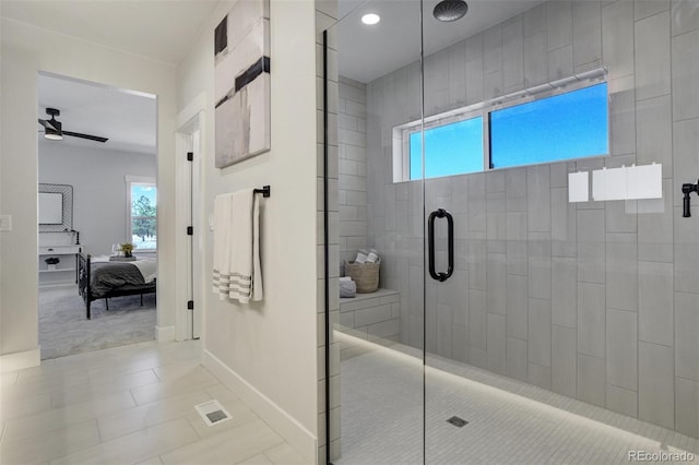 16510 Early Light Dr, Colorado Springs, CO 80908 - bathroom featuring connected bathroom, tile patterned floors, a ceiling fan, baseboards, and tiled shower