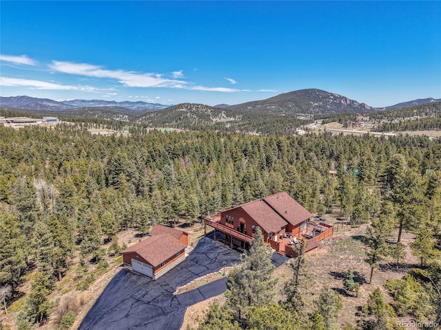 10786 Marclif Rd, Conifer, CO 80433 - view of subject property with a heavily wooded area and a mountainous background