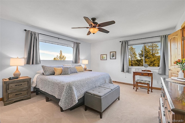 10786 Marclif Rd, Conifer, CO 80433 - bedroom featuring light carpet, baseboards, and a ceiling fan
