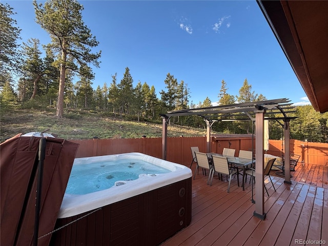 10786 Marclif Rd, Conifer, CO 80433 - deck featuring a hot tub, outdoor dining space, and fence