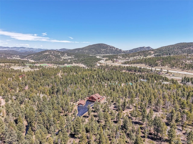 10786 Marclif Rd, Conifer, CO 80433 - drone / aerial view of mountains and a heavily wooded area
