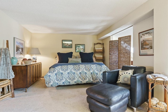bedroom featuring light colored carpet and a textured ceiling