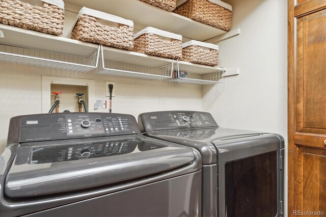 clothes washing area featuring washing machine and dryer