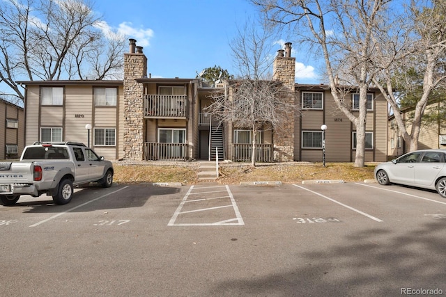 1876 S Pitkin Cir Unit B, Aurora, CO 80017 - view of building exterior featuring uncovered parking