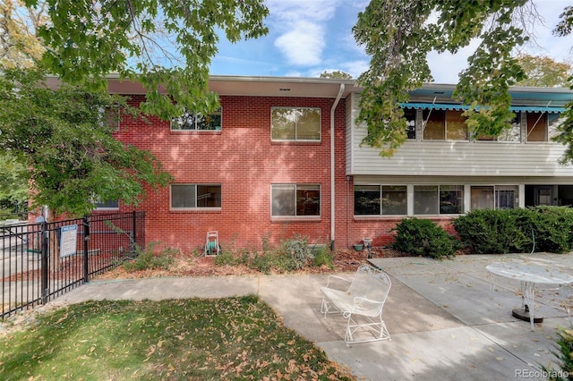 rear view of house with a patio