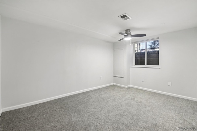 unfurnished room featuring carpet floors, baseboards, ceiling fan, and visible vents