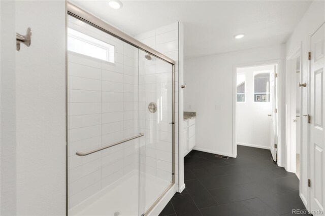 full bathroom with tile patterned flooring, a shower stall, baseboards, recessed lighting, and vanity