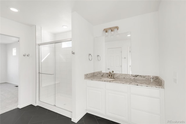 full bath with tile patterned floors, a stall shower, recessed lighting, baseboards, and vanity