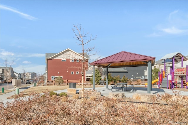 exterior space featuring a gazebo, a residential view, and playground community