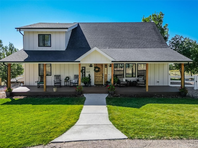 modern farmhouse featuring a front yard and a porch