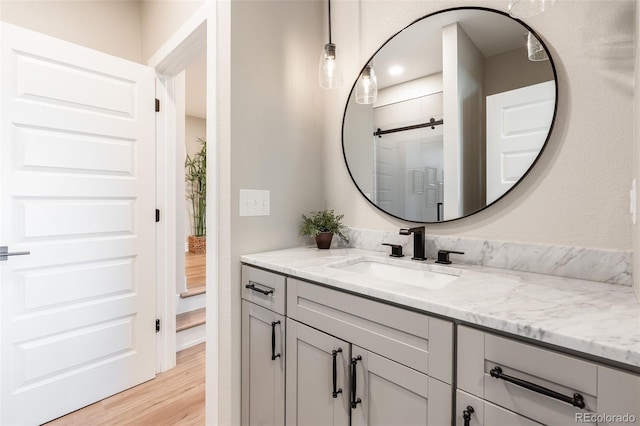 bathroom featuring vanity and wood-type flooring