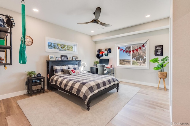 bedroom featuring light hardwood / wood-style floors and ceiling fan