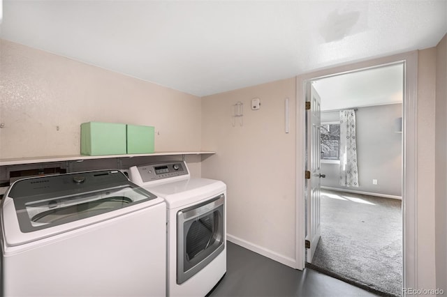 laundry room with separate washer and dryer, baseboards, and dark colored carpet