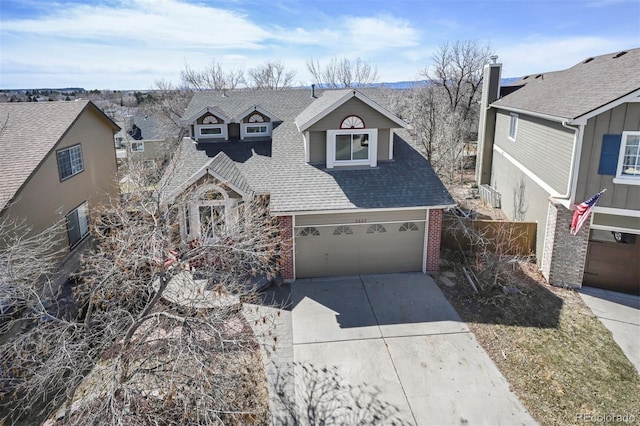 view of front of home with a garage, brick siding, concrete driveway, and a shingled roof