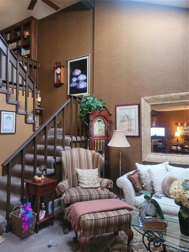 interior space with carpet flooring, a high ceiling, and stairs