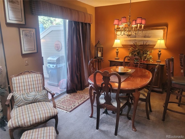 carpeted dining area featuring an inviting chandelier