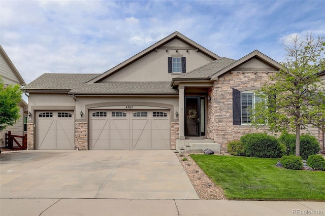 4767 S Odessa St, Centennial, CO 80015 - view of front of property featuring stucco siding, stone siding, and an attached garage