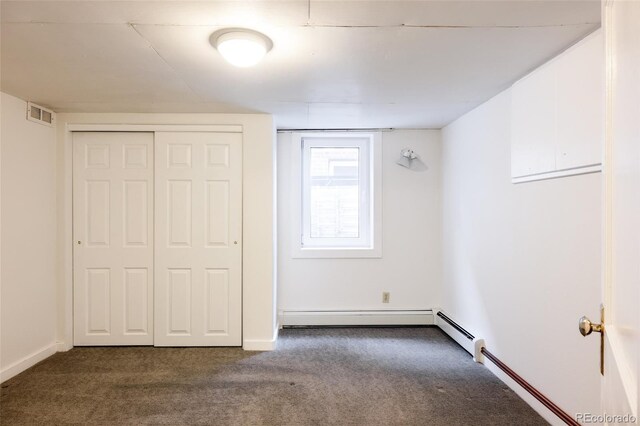 unfurnished bedroom with a closet, baseboards, visible vents, and carpet flooring