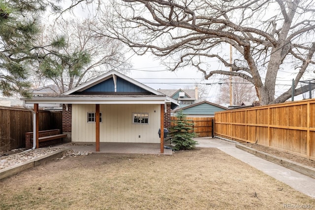 back of house with a patio area and a fenced backyard