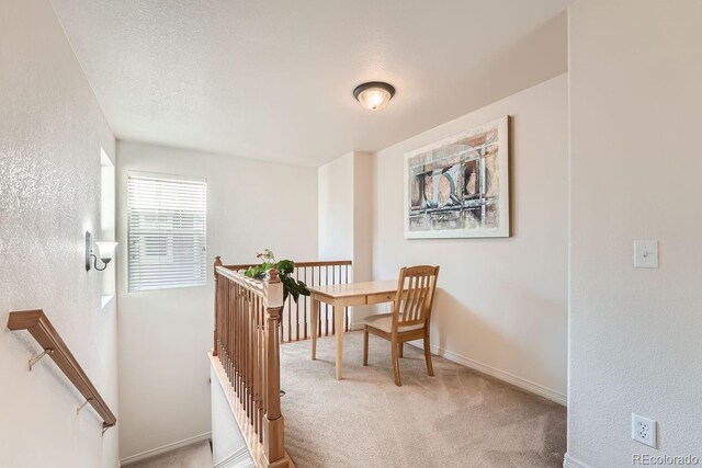 5892 W 94th Pl, Westminster, CO 80031 - living area with an upstairs landing, carpet flooring, baseboards, and a textured wall