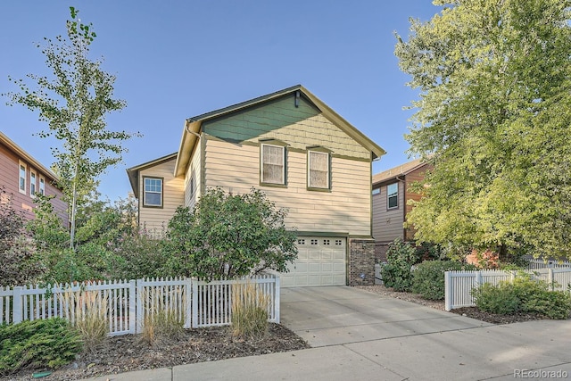 5892 W 94th Pl, Westminster, CO 80031 - view of front of house featuring concrete driveway, a garage, and fence