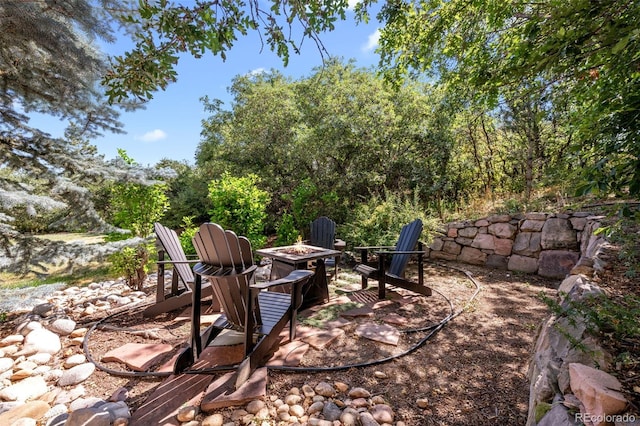 view of patio / terrace featuring an outdoor fire pit