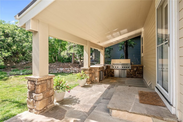 view of patio with a grill and area for grilling